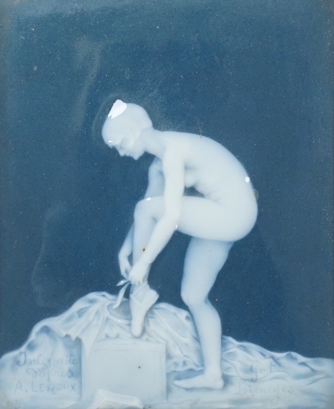 A framed Limoges pate sur pate plaque, after A. Leroux, depicting a ballet dancer undressing, plaque 14 cm X 11.5 cm